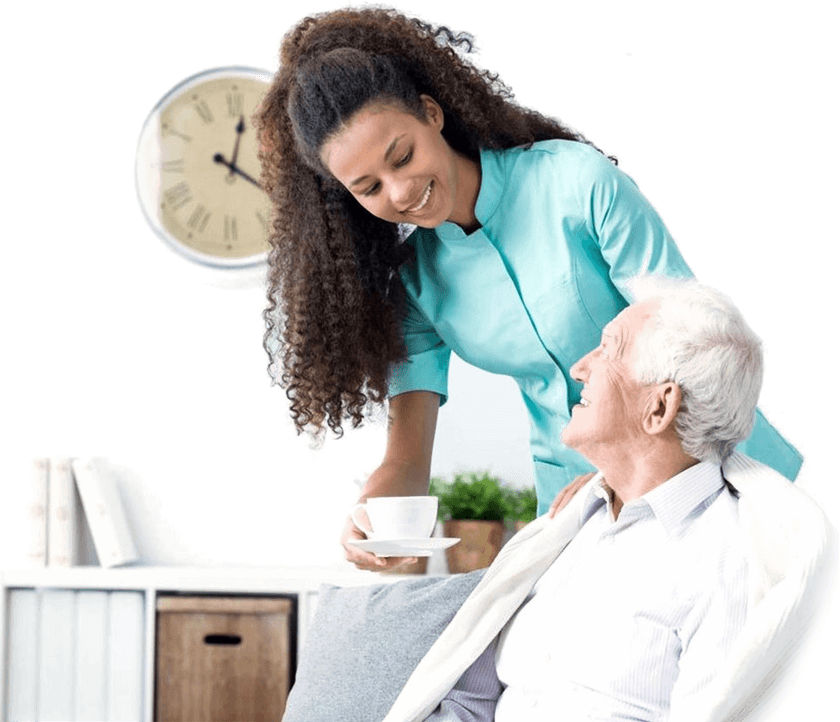 A woman is helping an old man to sit down.